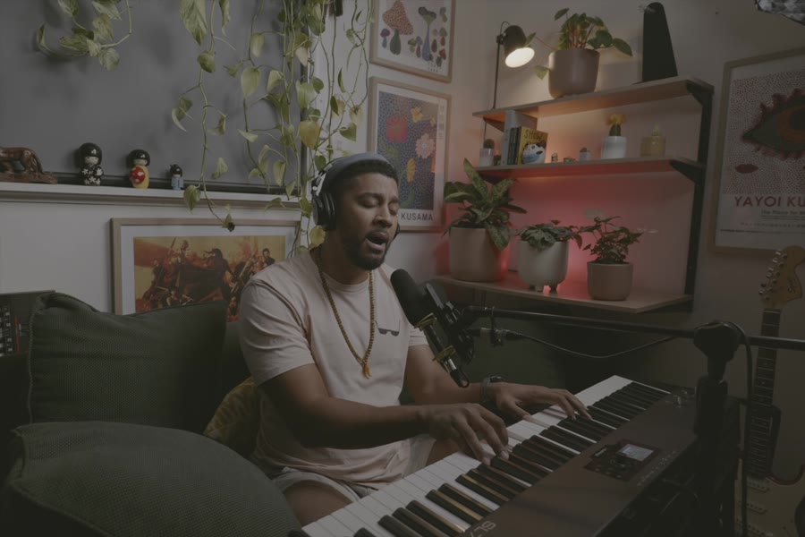 Kwame at the keyboard, singing